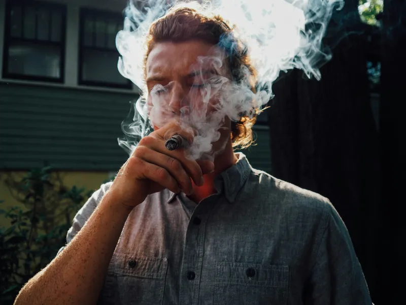man-smoking-cigar-by-charles-etoroma-unsplash.webp.29b5e344c07a63d2872dda5c2be7a3fc.webp